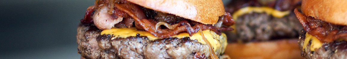Eating American (Traditional) Burger at Fatburger & Buffalo's Express restaurant in Barstow, CA.